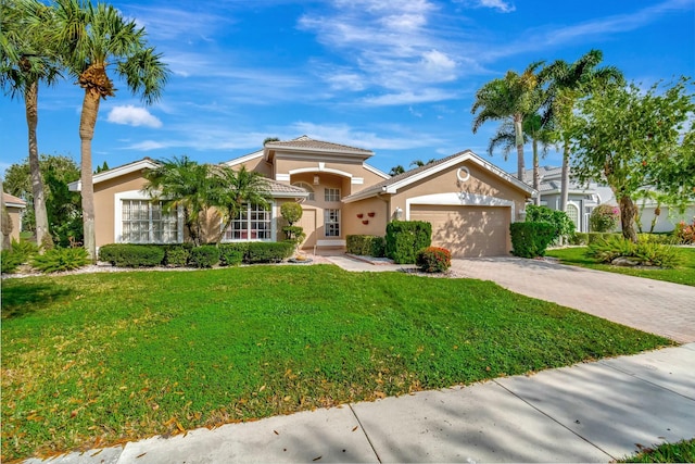 view of front facade featuring a garage and a front yard