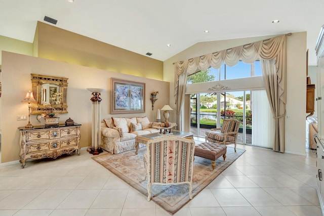 tiled living room with high vaulted ceiling