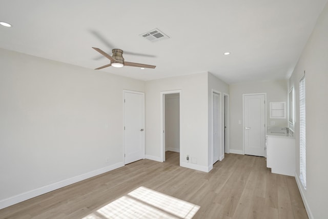 unfurnished room featuring ceiling fan and light hardwood / wood-style flooring