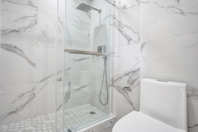 bathroom featuring an enclosed shower and toilet