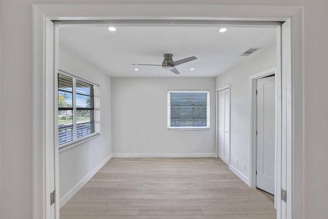 unfurnished room with light hardwood / wood-style flooring and ceiling fan