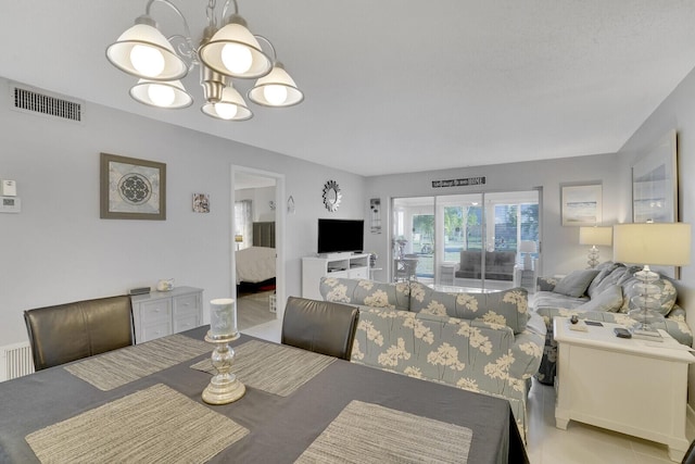 dining area featuring a notable chandelier