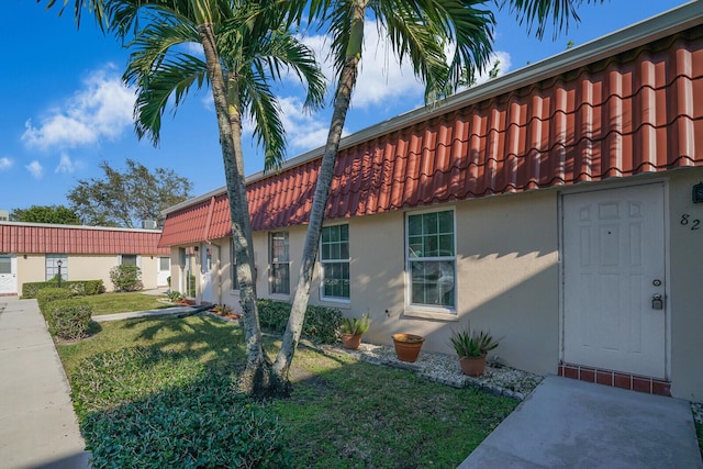 exterior space with a front lawn