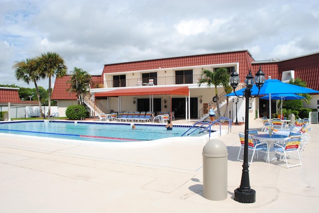 view of swimming pool with a patio