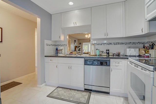 kitchen with white cabinetry, sink, light tile patterned flooring, and white appliances