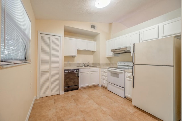 kitchen with sink, white appliances, white cabinets, light tile patterned flooring, and vaulted ceiling