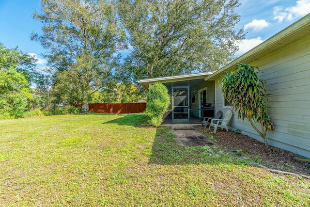 view of yard with a sunroom