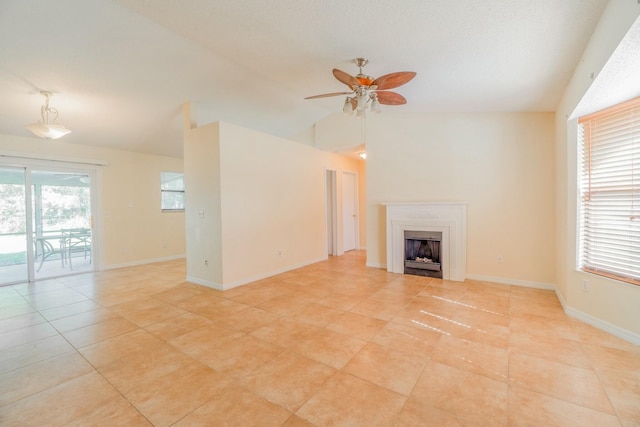 unfurnished living room featuring vaulted ceiling, light tile patterned floors, and ceiling fan