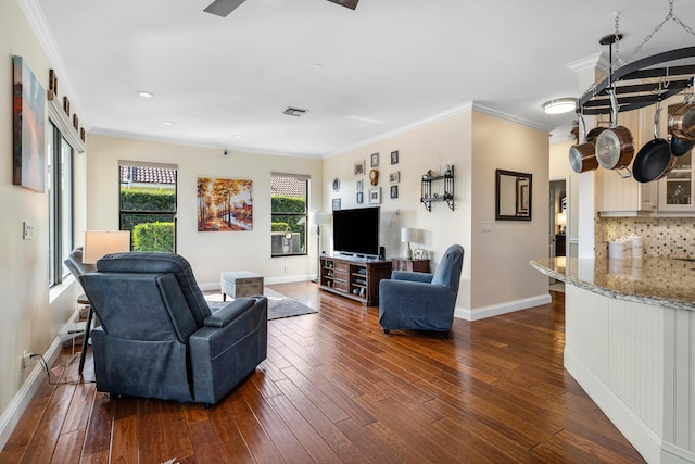 living room featuring dark wood-type flooring and crown molding