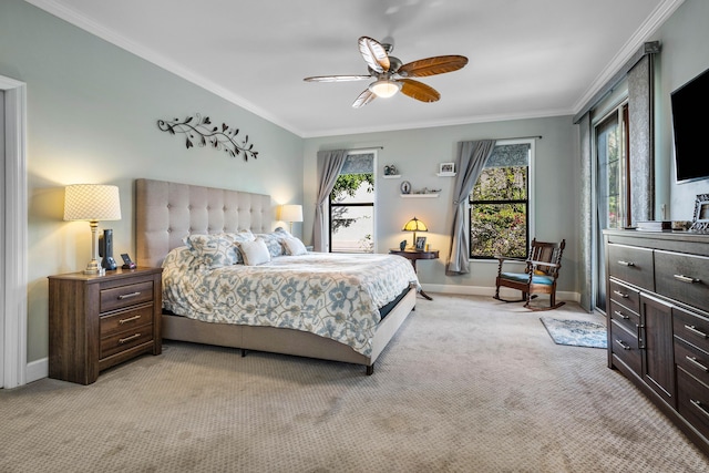 carpeted bedroom with crown molding and ceiling fan