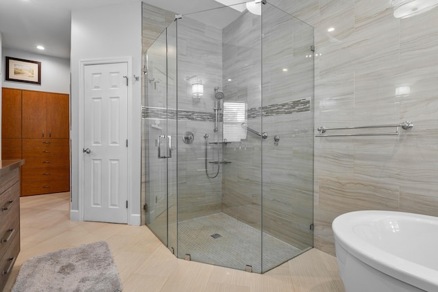 bathroom with tile patterned floors and plus walk in shower