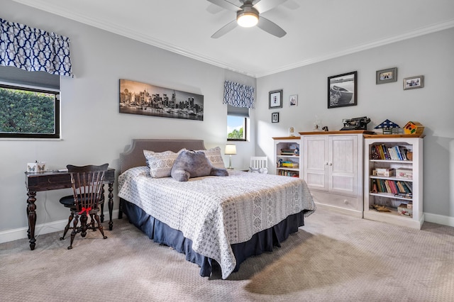 carpeted bedroom with crown molding and ceiling fan