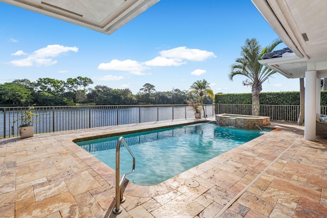 view of swimming pool featuring a patio area, pool water feature, a water view, and an in ground hot tub