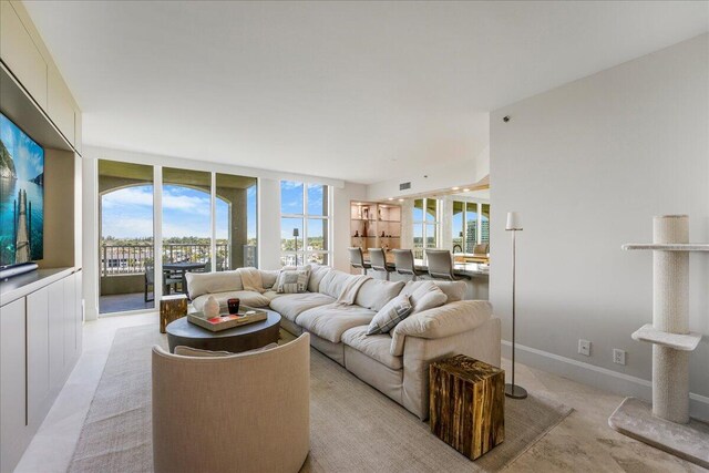 dining space with floor to ceiling windows and a chandelier