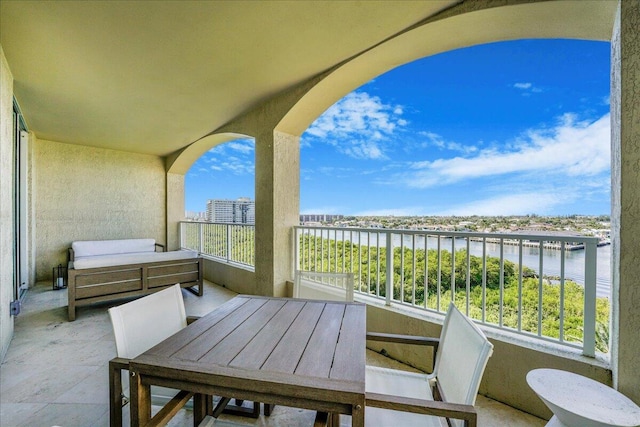 balcony featuring a water view