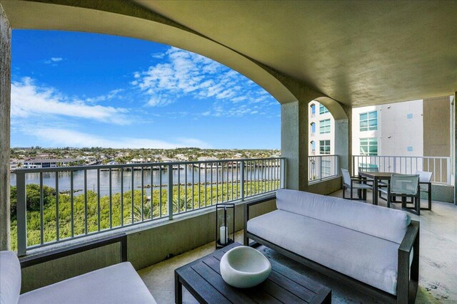 balcony featuring a water view