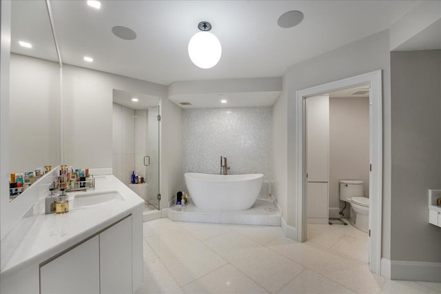 full bathroom featuring vanity, toilet, tile patterned flooring, and plus walk in shower