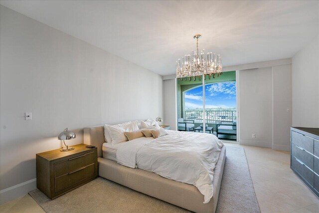 bedroom featuring an inviting chandelier