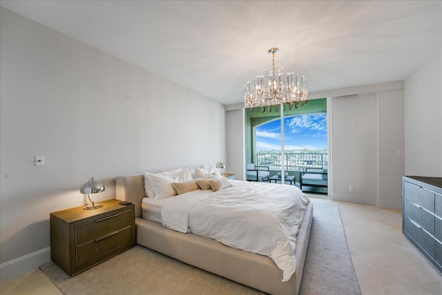 bedroom featuring an inviting chandelier and access to exterior