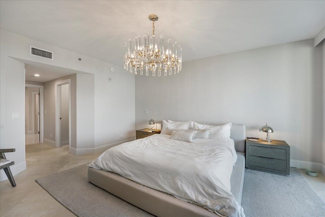 bedroom with a notable chandelier