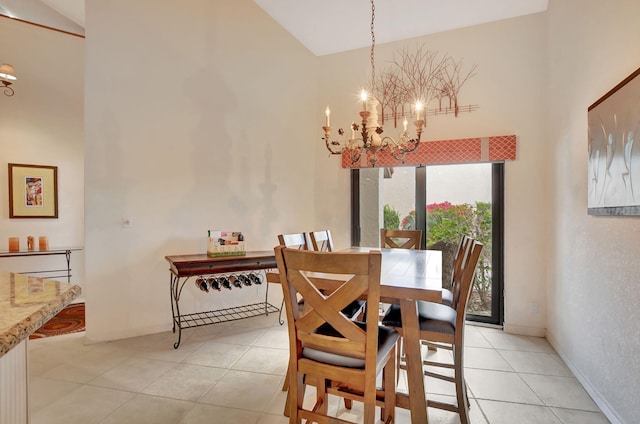 tiled dining area with an inviting chandelier and high vaulted ceiling