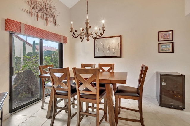 dining area with light tile patterned floors and a chandelier