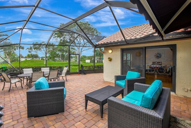 view of patio / terrace with an outdoor hangout area and glass enclosure