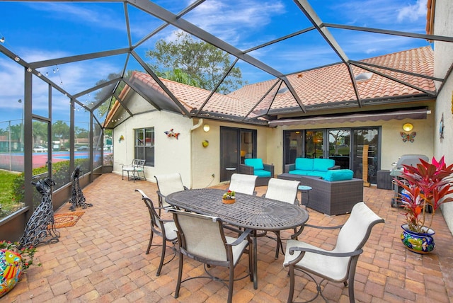 view of patio with outdoor lounge area and a lanai