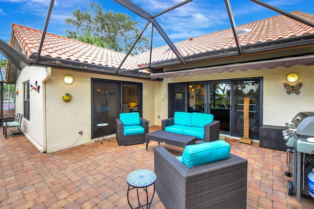 view of patio / terrace featuring outdoor lounge area and a lanai