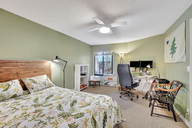 carpeted bedroom with a textured ceiling and ceiling fan