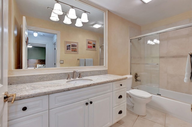 full bathroom with tile patterned floors, vanity, toilet, and enclosed tub / shower combo