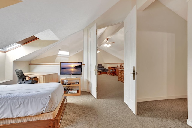 bedroom featuring light colored carpet and vaulted ceiling