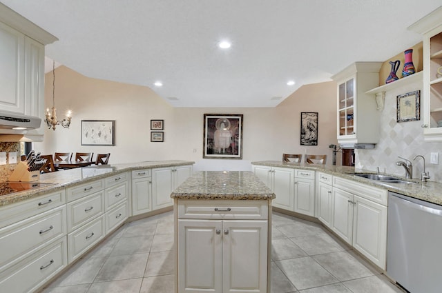 kitchen featuring sink, hanging light fixtures, a center island, stainless steel dishwasher, and light stone countertops