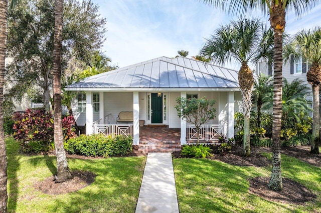 view of front of house featuring a front yard and a porch