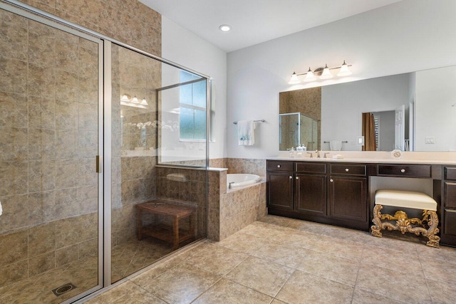 bathroom with tile patterned floors, vanity, and plus walk in shower