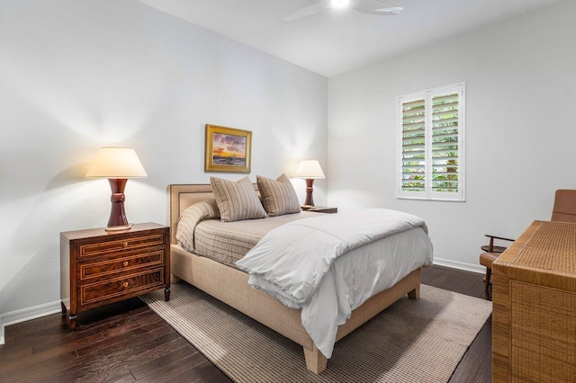 bedroom with ceiling fan and dark hardwood / wood-style flooring