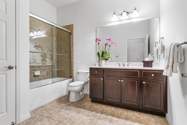 full bathroom featuring tile patterned flooring, vanity, shower / bath combination with glass door, and toilet