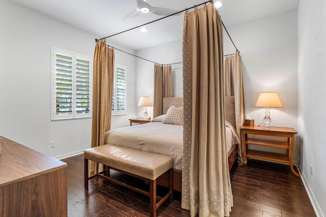 bedroom with dark hardwood / wood-style floors