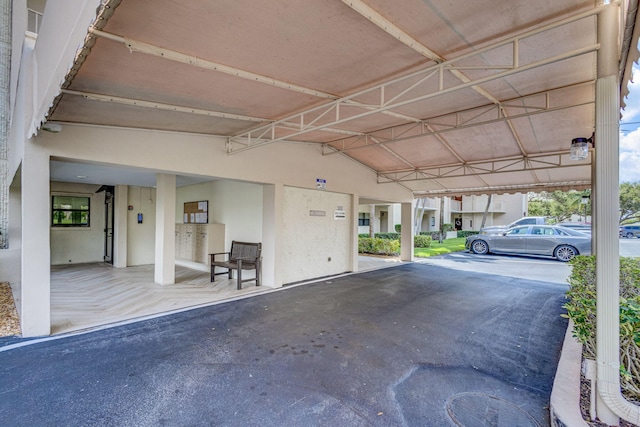 garage featuring a carport