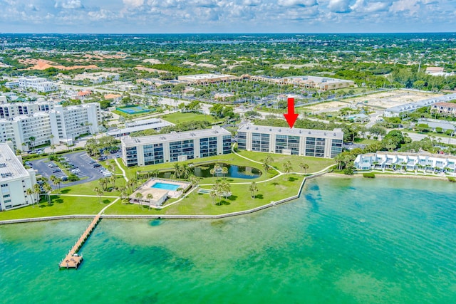 birds eye view of property with a water view