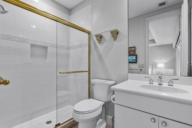 bathroom with vanity, an enclosed shower, and toilet