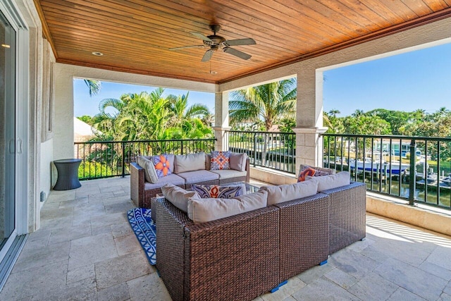 view of patio / terrace with an outdoor hangout area, ceiling fan, and a water view