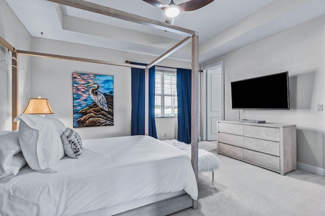 bedroom with light colored carpet and ceiling fan