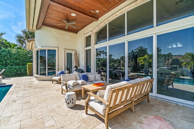 view of patio featuring an outdoor living space and ceiling fan