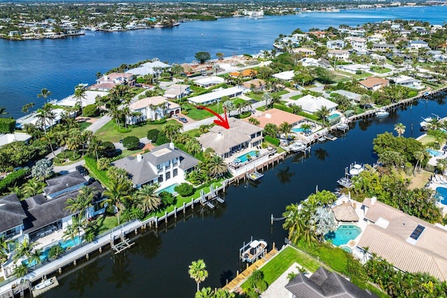 birds eye view of property featuring a water view