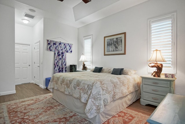 bedroom featuring light hardwood / wood-style flooring and ceiling fan