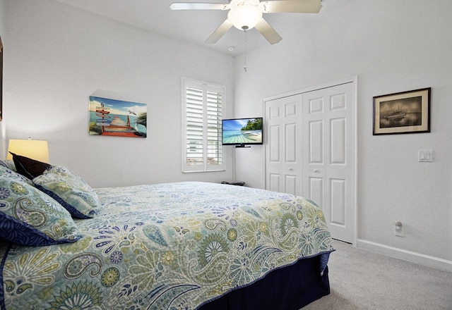 bedroom with a closet, ceiling fan, and carpet