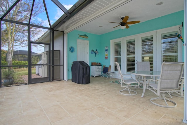 sunroom / solarium with a skylight and ceiling fan