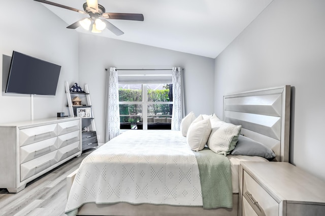 bedroom featuring ceiling fan, lofted ceiling, and light hardwood / wood-style floors