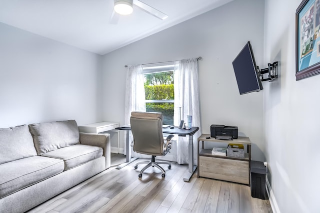 office area featuring ceiling fan, lofted ceiling, and light hardwood / wood-style flooring